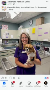 A picture of a woman holding a dog